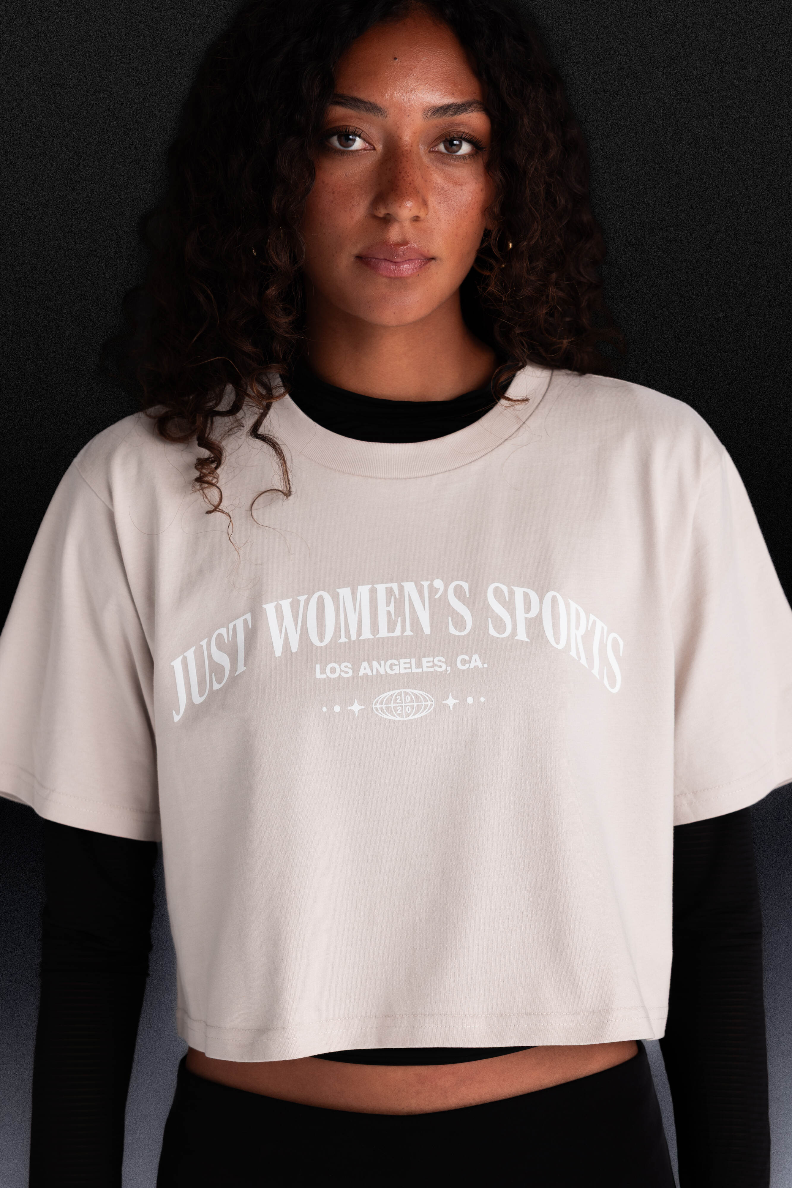 Person wearing a beige Just Women's Sports t-shirt