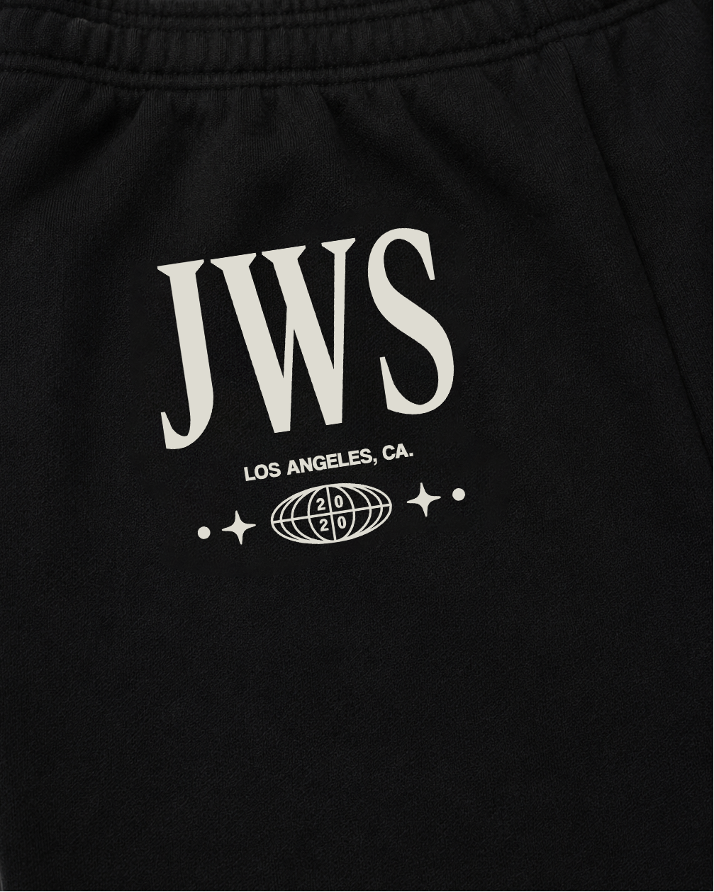 Black sweatpants with JWS logo and text