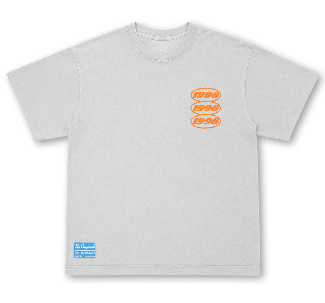 A light gray crewneck t-shirt featuring three orange oval graphics stacked vertically on the left chest