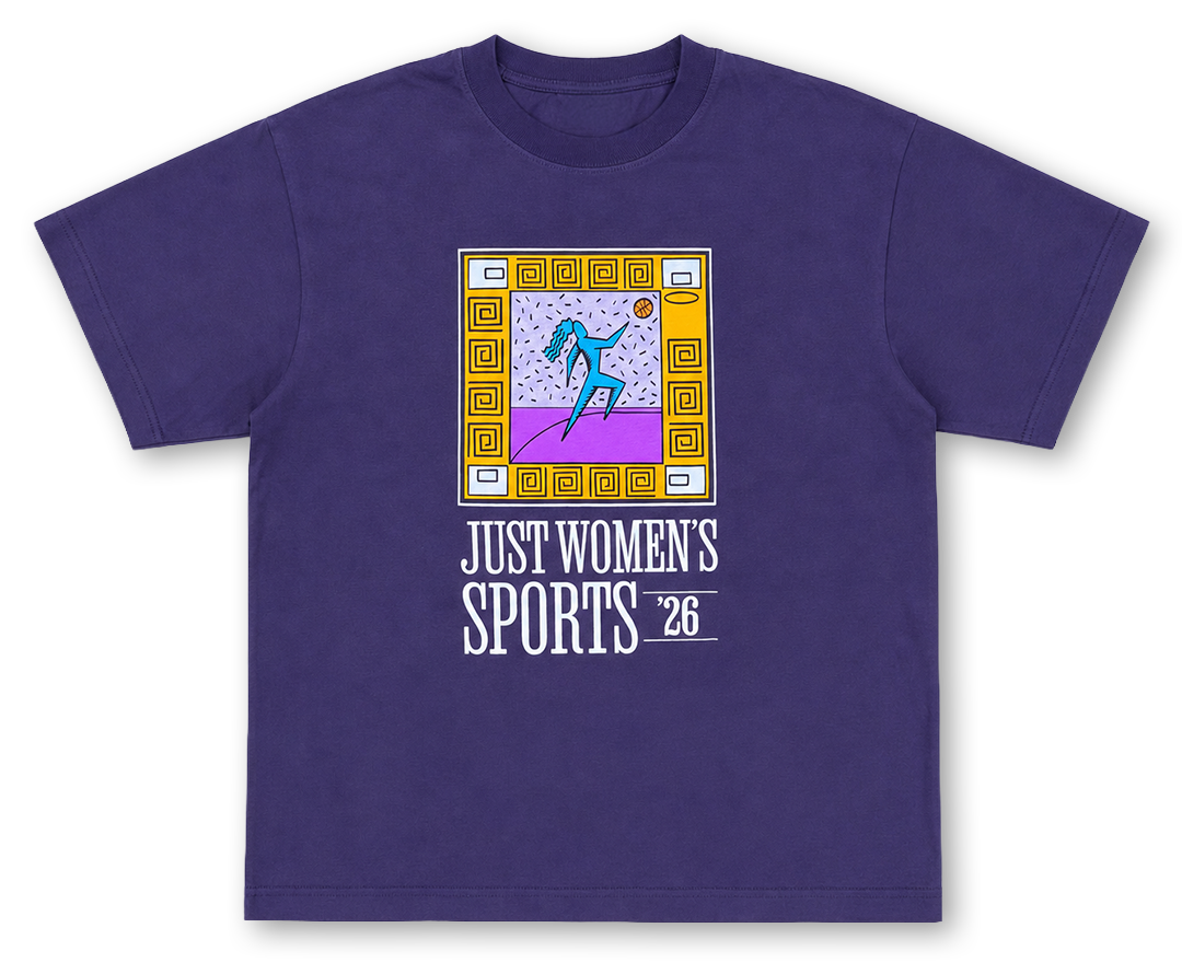 A purple short-sleeve crewneck t-shirt featuring a retro-style graphic of a female runner in a yellow and purple frame, with the text 'JUST WOMEN'S SPORTS 26' printed below.
