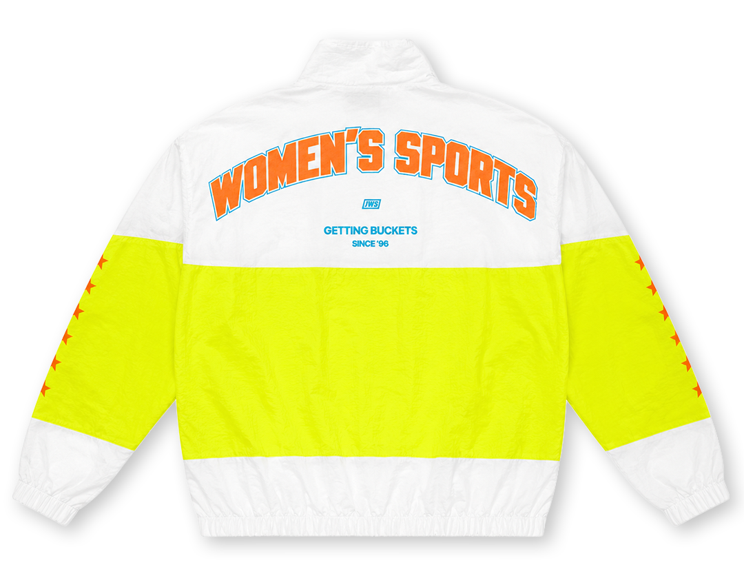 White and neon yellow windbreaker jacket shown from the back, featuring 'WOMEN'S SPORTS' in orange text with a blue outline across the upper back, and 'GETTING BUCKETS UNIL 96' printed below in blue. The sleeves and lower back are bright neon yellow, and the collar, upper back, and cuffs are white.